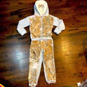 Fleece lined matching two piece sweatsuit with sequins.